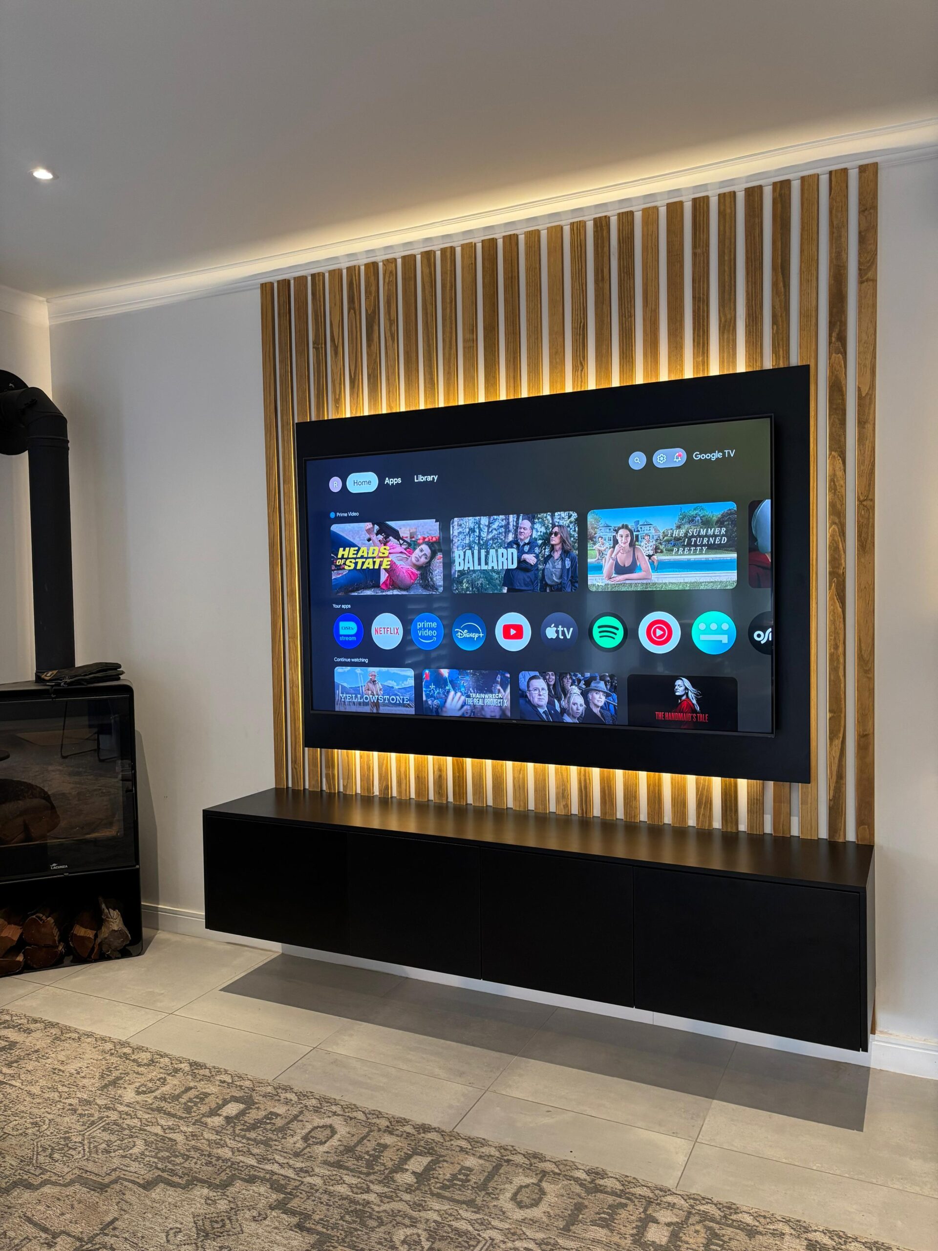 Custom floating TV unit with integrated lighting and hidden storage - modern entertainment center by Oakmont Kitchens Gauteng