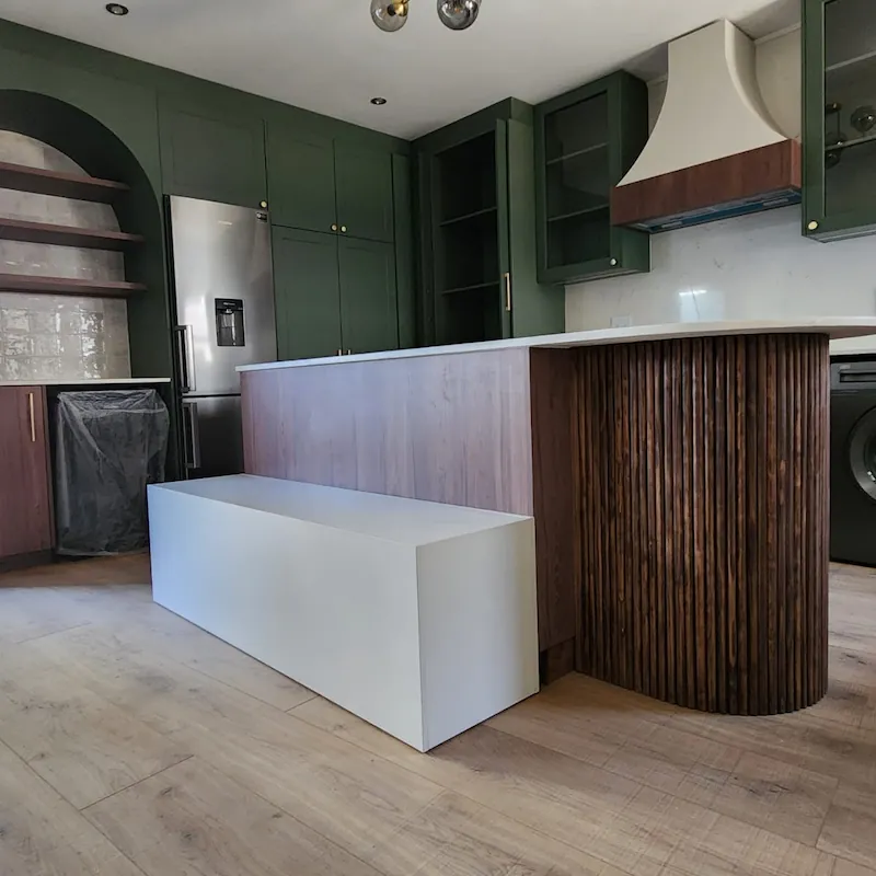 Kitchen renovation for Parkhurst A luxurious classic contemporary styled kitchen with rich sage green and dark warm wood elements
